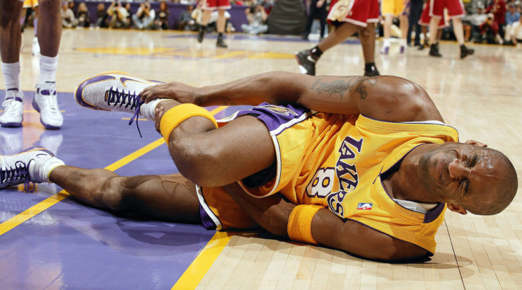 UNITED STATES - JANUARY 13:  Basketball: Los Angeles Lakers Kobe Bryant with ankle injury during game vs Cleveland Cavaliers, Los Angeles, CA 1/13/2005  (Photo by John W. McDonough/Sports Illustrated/Getty Images)  (SetNumber: X72648 TK1)